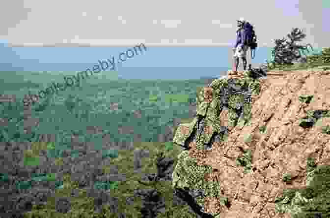 A Couple Hiking Along A Scenic Trail In Michigan's Upper Peninsula Michigan Day Trips By Theme (Day Trip Series)