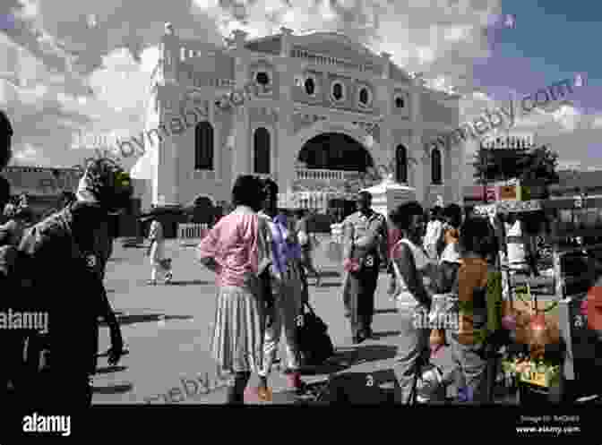 A Lively Street Scene In Kingston, Jamaica, With People Going About Their Daily Lives, Colorful Buildings, And A Bustling Atmosphere. Finding Samuel Lowe: China Jamaica Harlem