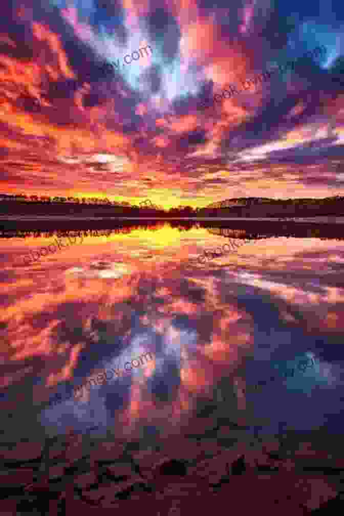 A Sunset Reflecting On A Calm Lake, Symbolizing The Author's Journey Of Self Discovery Education Of A Wandering Man: A Memoir