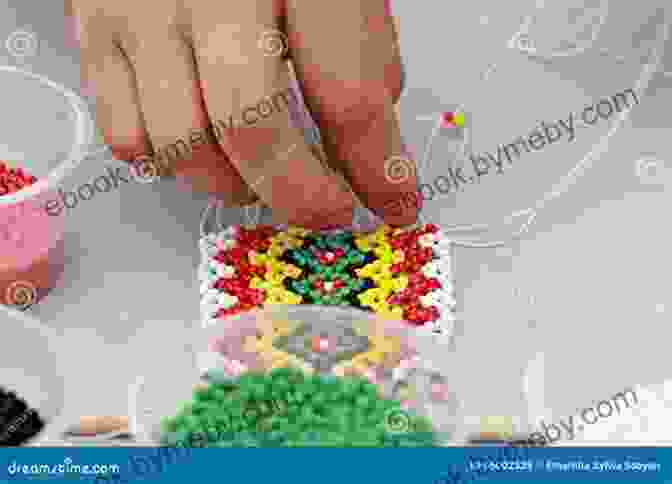 Close Up Of A Hand Demonstrating Beading Techniques, Emphasizing The Intricate Craftsmanship Involved Big Of Indian Beadwork Designs (Dover Needlework)